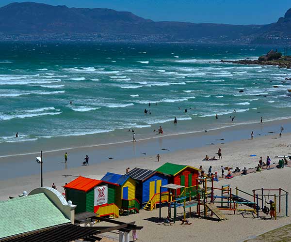 Surfer riding a wave at Muizenberg Beach in False Bay Cape Town