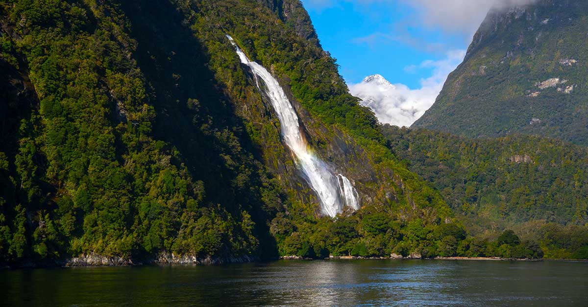 Waterfall cascading down the cliffs of Milford Sound after rainfall