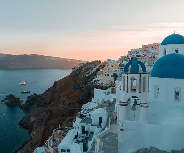 Santorini buildings and sea during golden hour