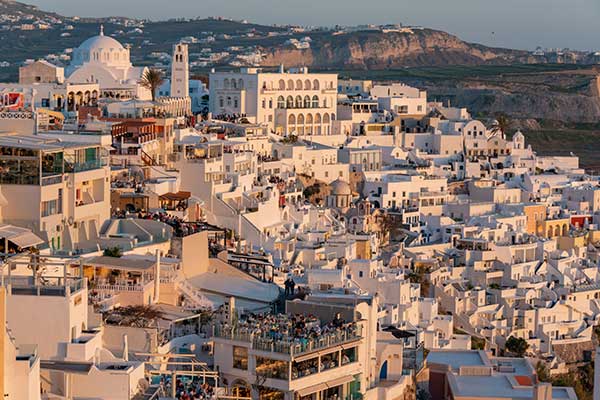 Whitewashed Santorini village at sunset