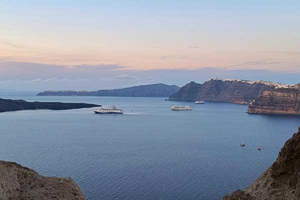 Santorini cliffs and Aegean Sea at golden hour