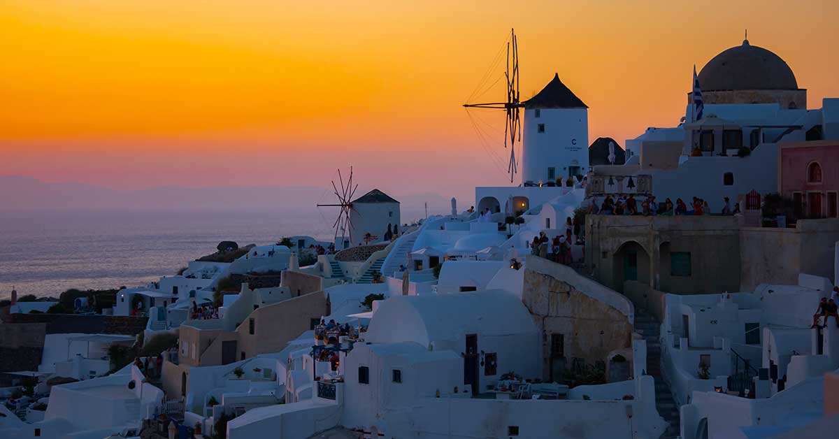 Santorini village overlooking the sea at sunset